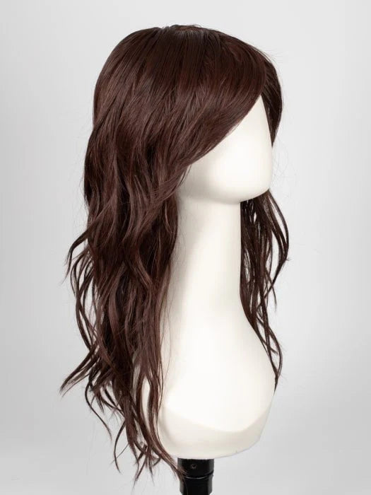 long wavy brown wig for women displayed on white mannequin head with side swept bangs and layered mid length waves