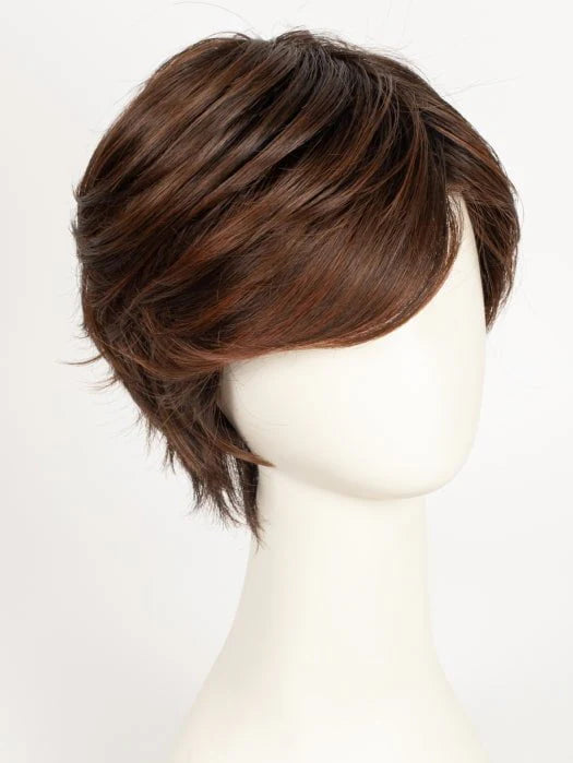 Natural brown short layered synthetic wig on white mannequin with side swept bangs and textured layers