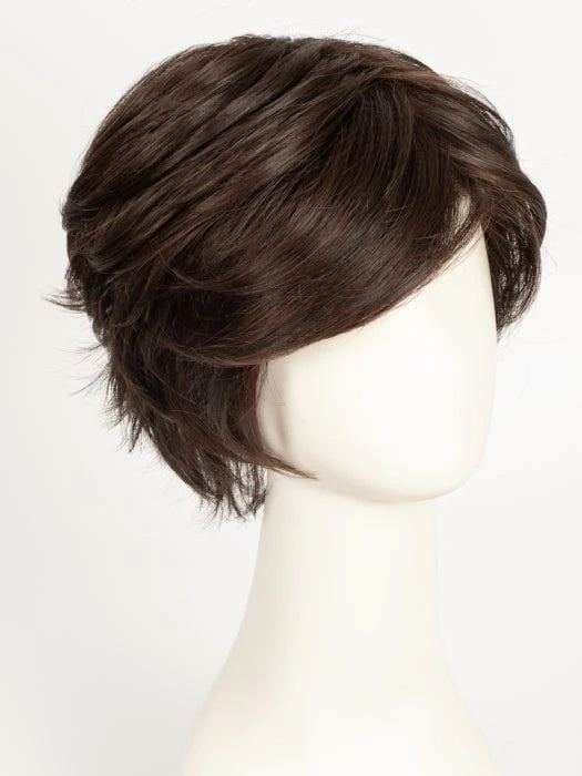 short layered synthetic wig in natural dark brown on mannequin with side swept bangs and textured layers