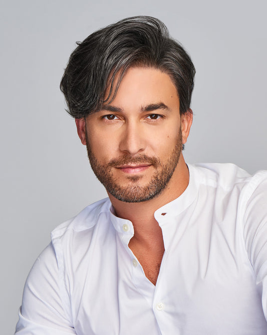 HairUWear Gallant HIM wig for men in salt and pepper side swept style on male model with light stubble