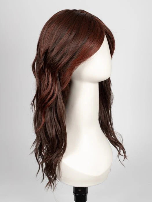 long wavy brown wig for women styled with side swept bangs and subtle auburn highlights on mannequin head