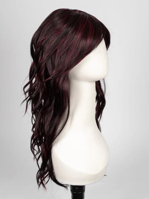 Mannequin displaying long wavy brown wig for women with side swept bangs and red highlights