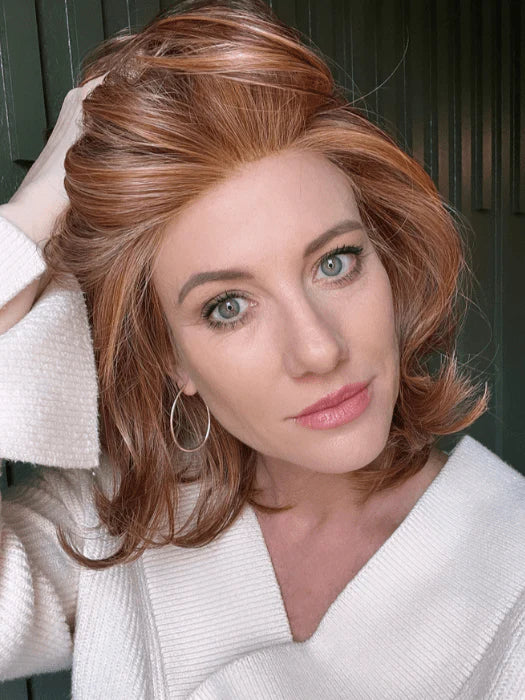 Model wearing Raquel Welch Goddess wig auburn shoulder length bob with volume and natural hairline